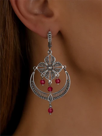 {{productViewItem.photos[photoViewList.activeNavIndex].Alt || productViewItem.photos[photoViewList.activeNavIndex].Description || 'Серьги из серебра с корундом'}}