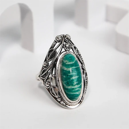 {{productViewItem.photos[photoViewList.activeNavIndex].Alt || productViewItem.photos[photoViewList.activeNavIndex].Description || 'Кольцо из серебра с амазонитом'}}