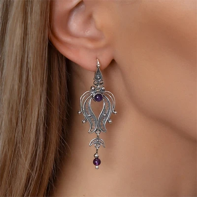 {{productViewItem.photos[photoViewList.activeNavIndex].Alt || productViewItem.photos[photoViewList.activeNavIndex].Description || 'Серьги из серебра с аметистом'}}