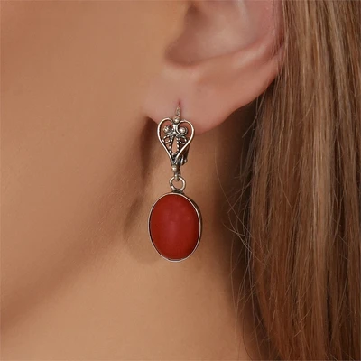 {{productViewItem.photos[photoViewList.activeNavIndex].Alt || productViewItem.photos[photoViewList.activeNavIndex].Description || 'Серьги из серебра с кораллом'}}