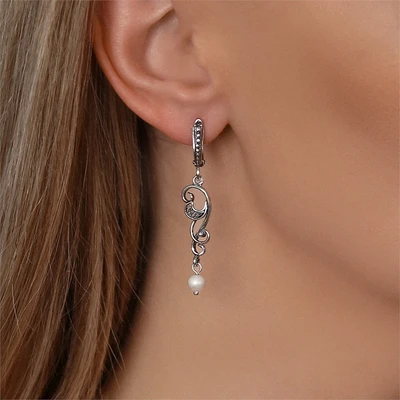 {{productViewItem.photos[photoViewList.activeNavIndex].Alt || productViewItem.photos[photoViewList.activeNavIndex].Description || 'Серьги из серебра с жемчугом'}}