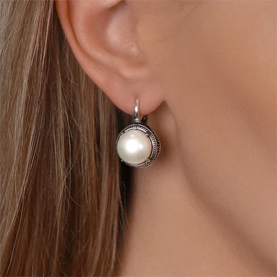 {{productViewItem.photos[photoViewList.activeNavIndex].Alt || productViewItem.photos[photoViewList.activeNavIndex].Description || 'Серьги из серебра с жемчугом'}}