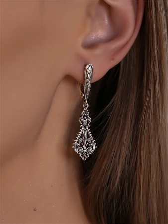 {{productViewItem.photos[photoViewList.activeNavIndex].Alt || productViewItem.photos[photoViewList.activeNavIndex].Description || 'Серьги из серебра в этно стиле'}}