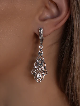 {{productViewItem.photos[photoViewList.activeNavIndex].Alt || productViewItem.photos[photoViewList.activeNavIndex].Description || 'Серьги из серебра'}}